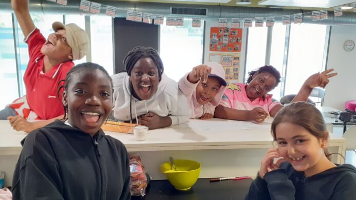 A group of six young people at Forest Road smiling 