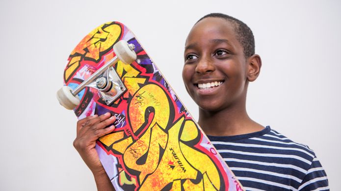 Boy with skateboard promoting Forest Road Easter activities