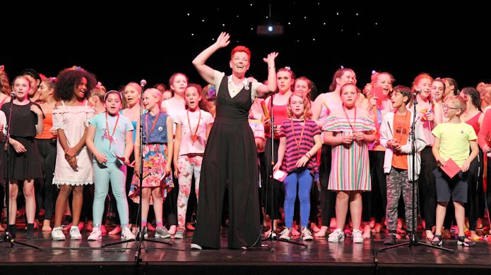 Young children on the stage during live performance at the I AM ME event at Hackney Empire